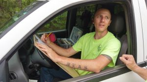 Josh sketching data map in truck